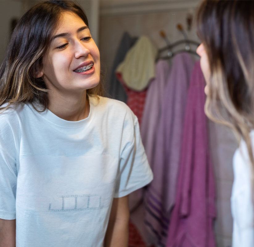 How can I properly care for my teeth while wearing braces?